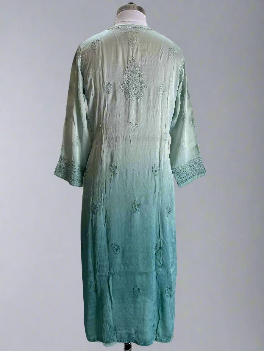 Teal embroidered dress on a mannequin against a plain background