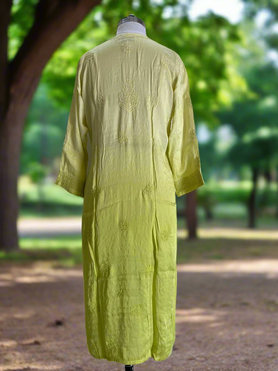 Light green dress on a mannequin against a plain background