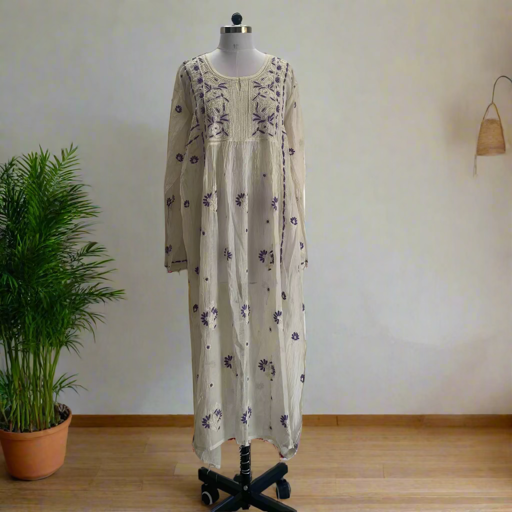 Long floral dress on a mannequin against a plain wall.