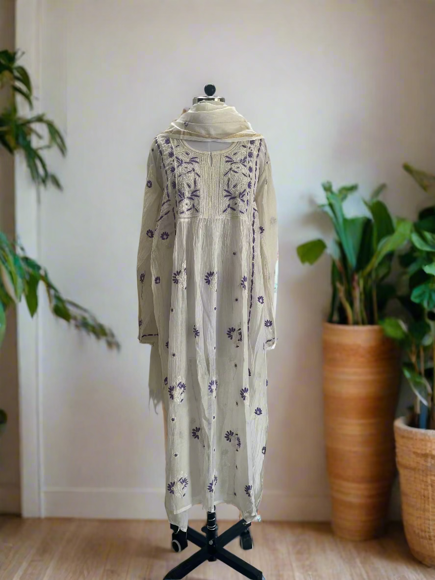 Long floral dress on a mannequin against a plain background