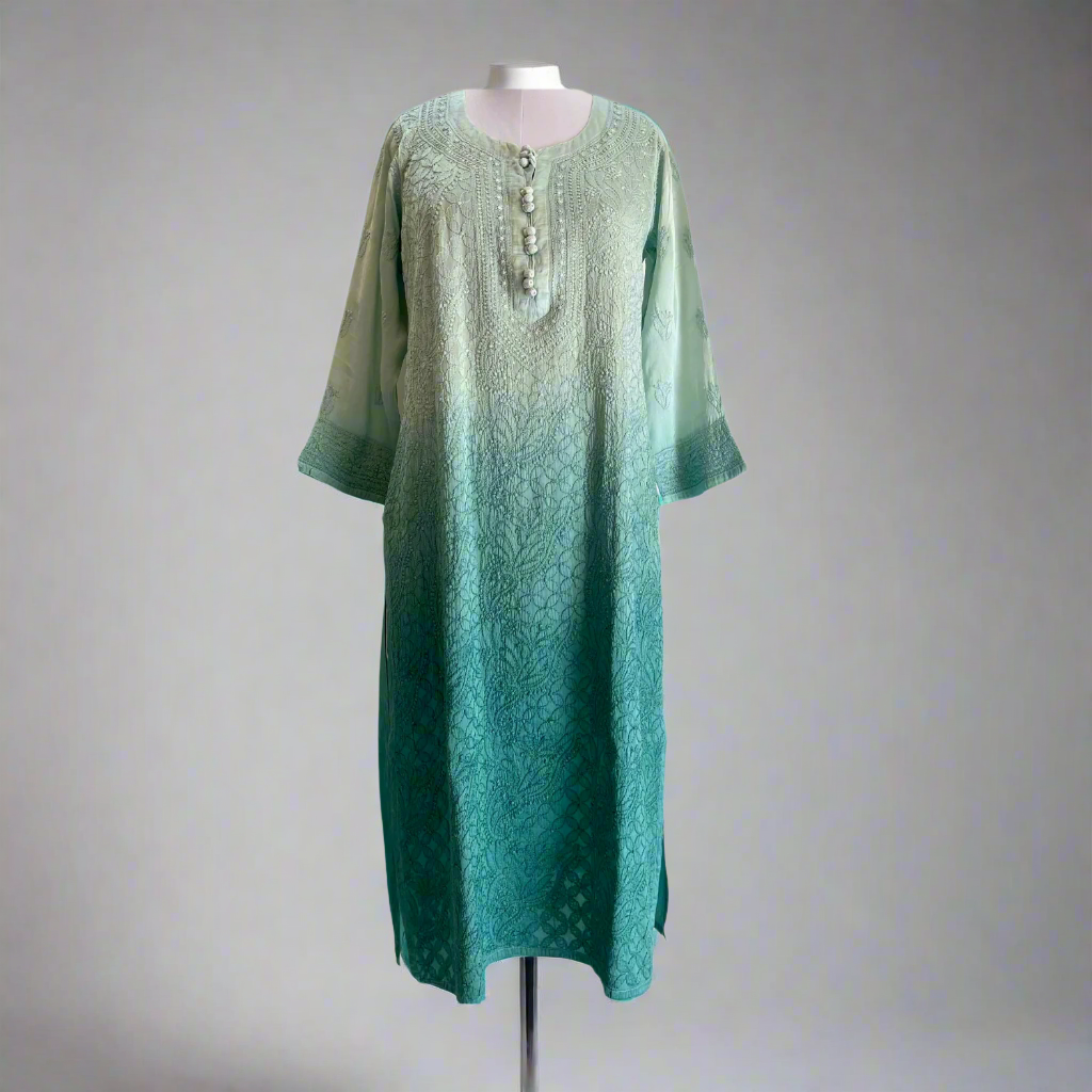 Teal and green gradient dress on a mannequin against a white background