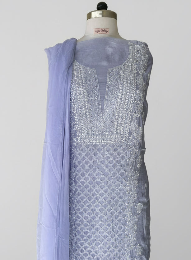 Light purple fabric with intricate white chikankari embroidery on muslin fabric 