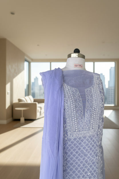 Light purple fabric with intricate white chikankari embroidery on muslin 