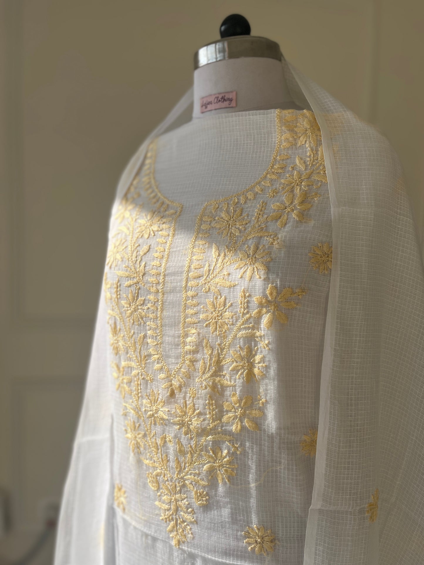 Unstitched Chikankari Suit Material – kota doriya with Hand-embroidered chikankari ghaspatti stitch in Pastel yellow white – Lajjaa.
